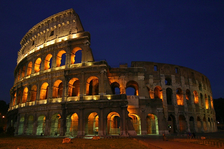 View of Colosseum. Lit in the evening. 